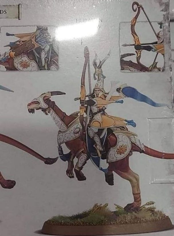 A blurry boxart picture of a new Lumineth Realm-Lords model, an elf in ornate armour firing a bow while riding an armoured kangaroo-like creature.