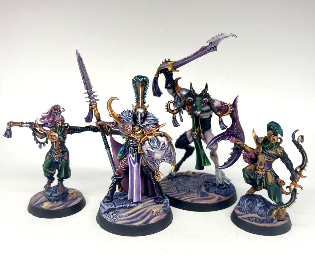 A photo of the four members of the Dread Pageant, the Slaanesh Warhammer Underworlds warband.