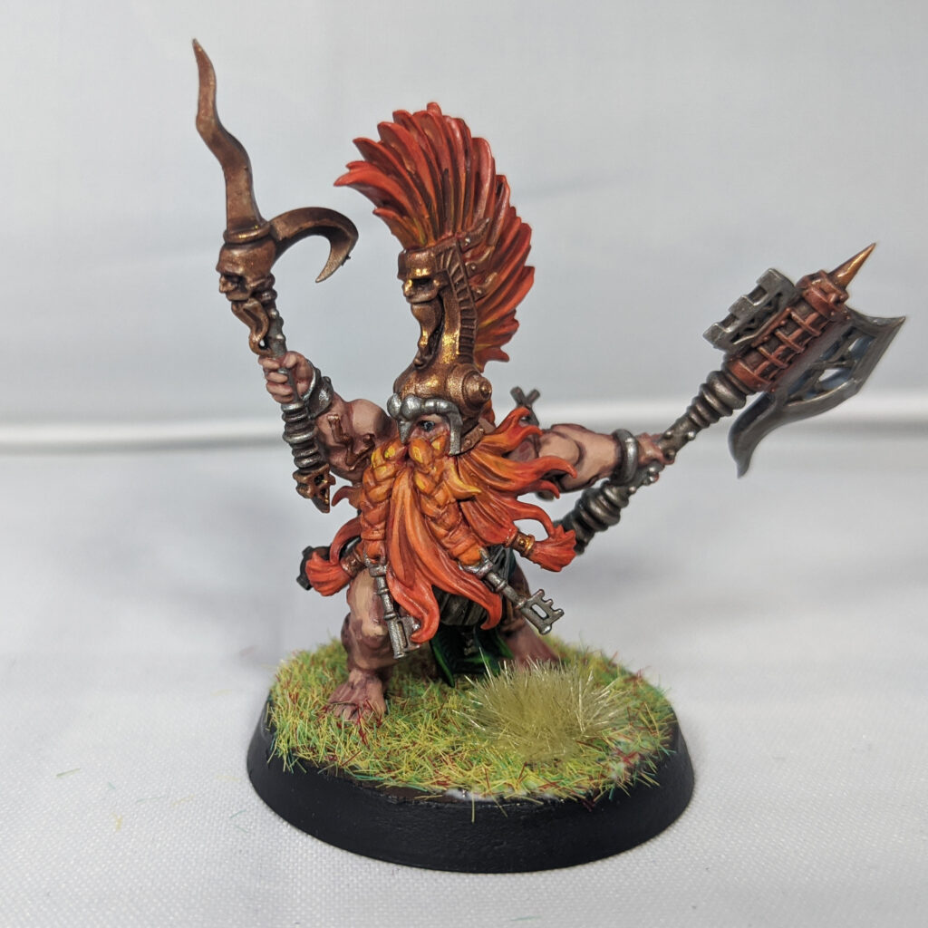 A Fyreslayer Doomseeker model, with a fiery orange beard and hair.