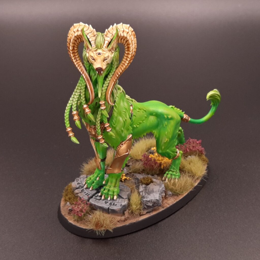 A mindstealer sphiranx, a feline monster with bright green fur.