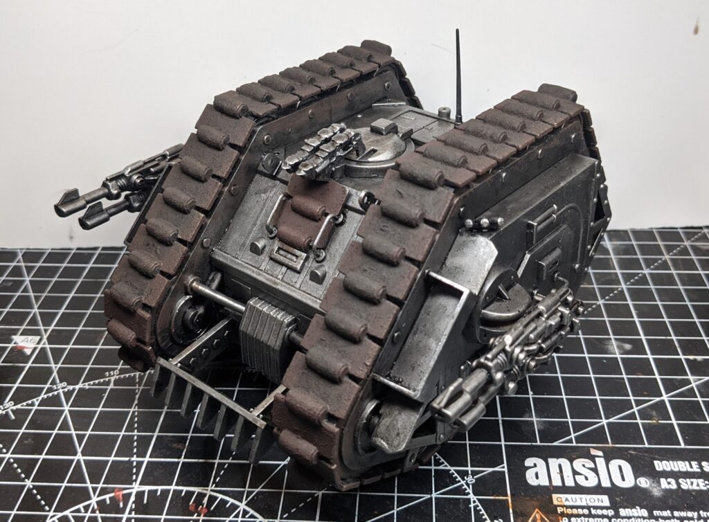 Front view of the vintage Rogue Trader-era Games Workshop Land Raider, with the track sections painted a rusty dark brown