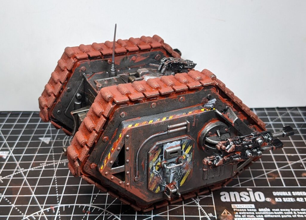 Side view of the land raider, with messily-applied orange red weathering