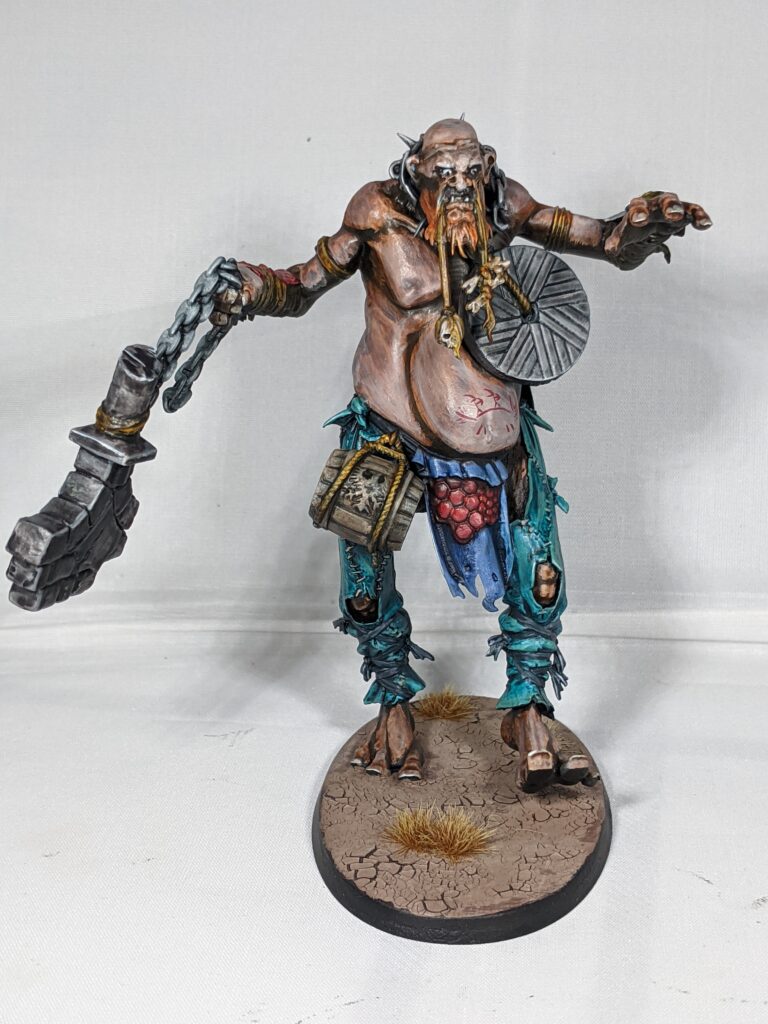 A re-posed mancrusher gargant model with the right leg back and the left leg stepping forwards. The model’s arms are held out in a way that looks like it is trying to balance itself.