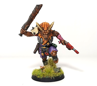 A charging beastman cultist miniature from the Black Fortress tabletop game. 